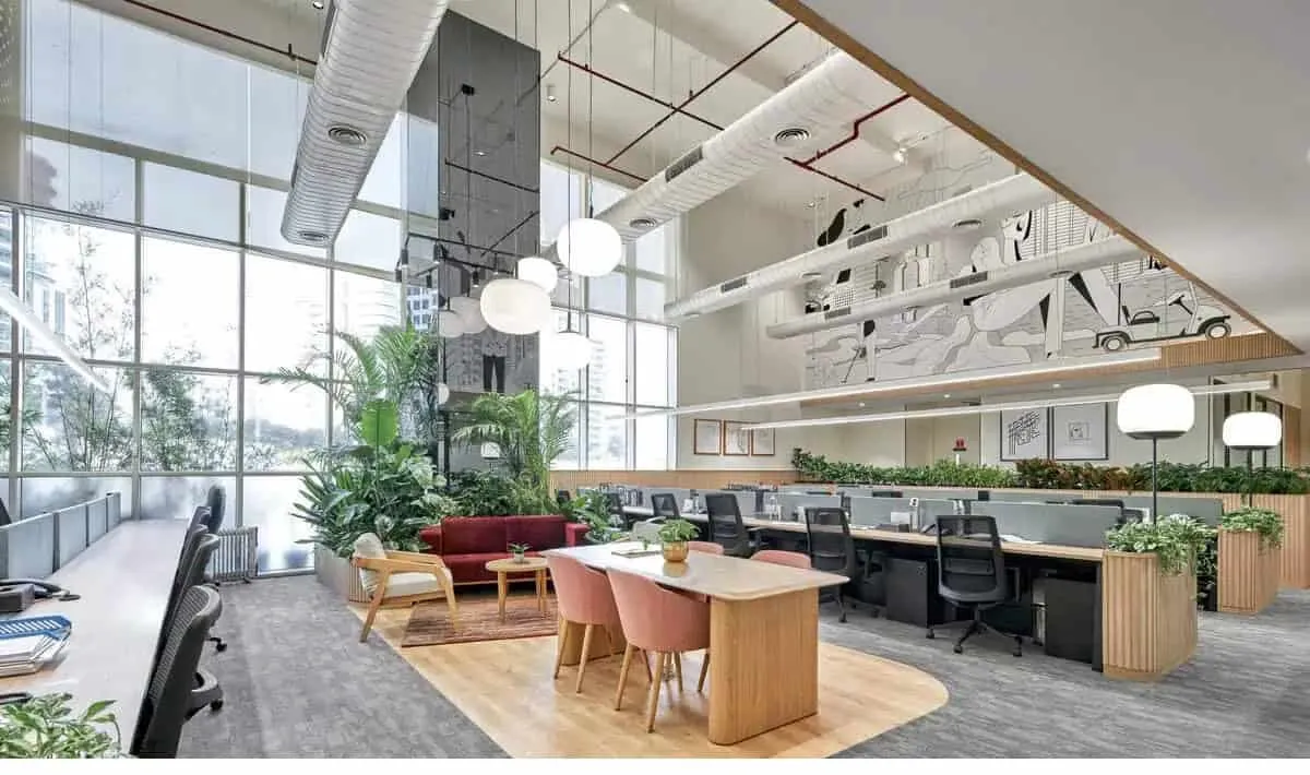 Professionals arranging printed agenda drafts on drafting table surface